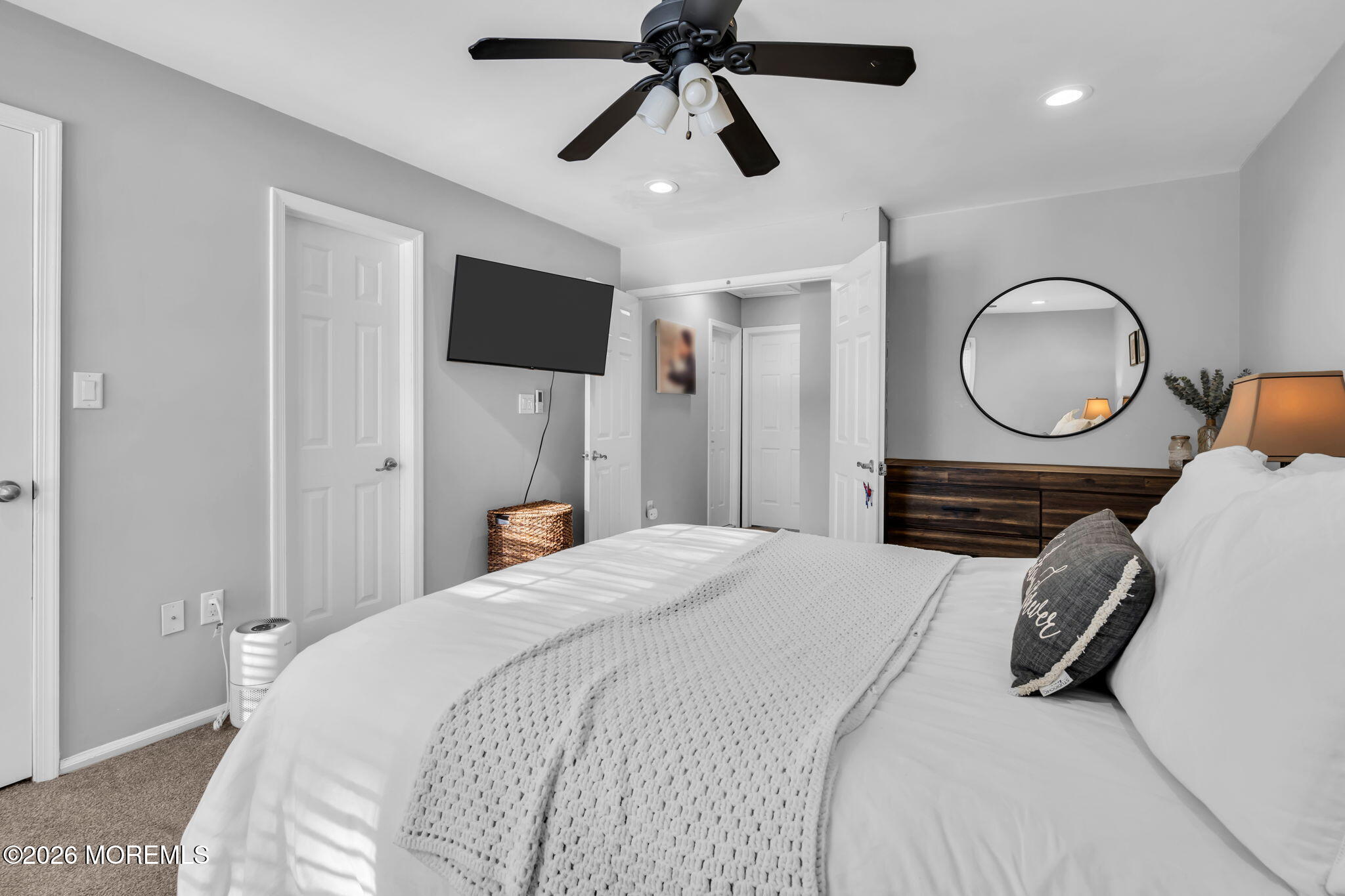 4 Duncan Way Freehold, NJ 07728 - Photo 24 of 28 a bedroom with a bed and a chandelier