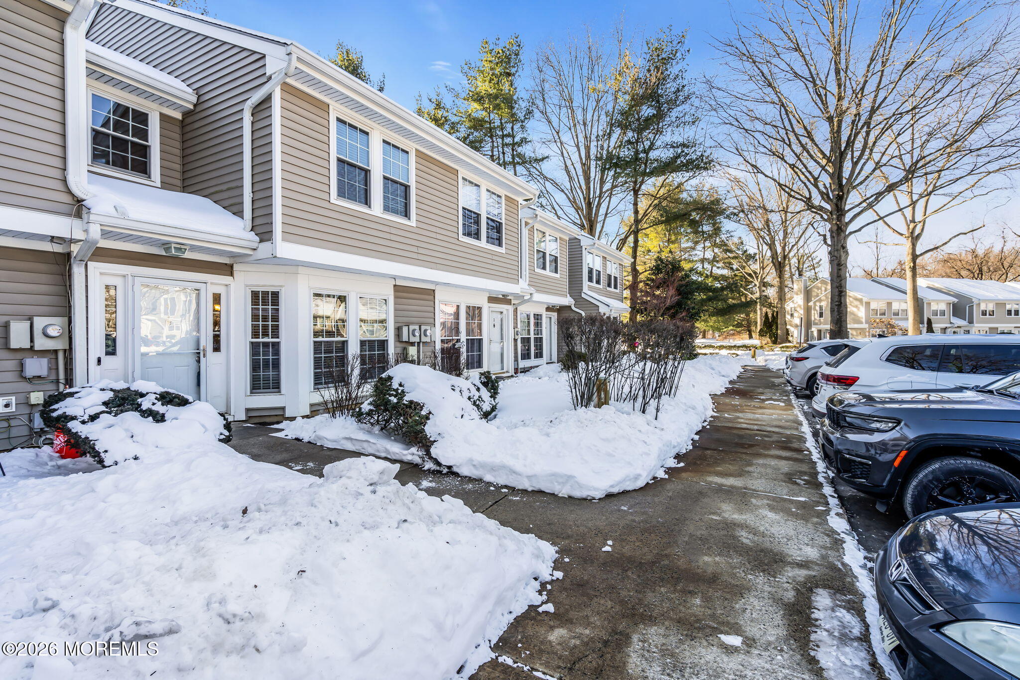 4 Duncan Way Freehold, NJ 07728 - Photo 4 of 28 a view of a white house with a bed and chairs