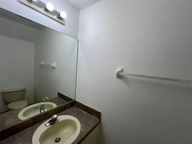 a bathroom with a sink and toilet