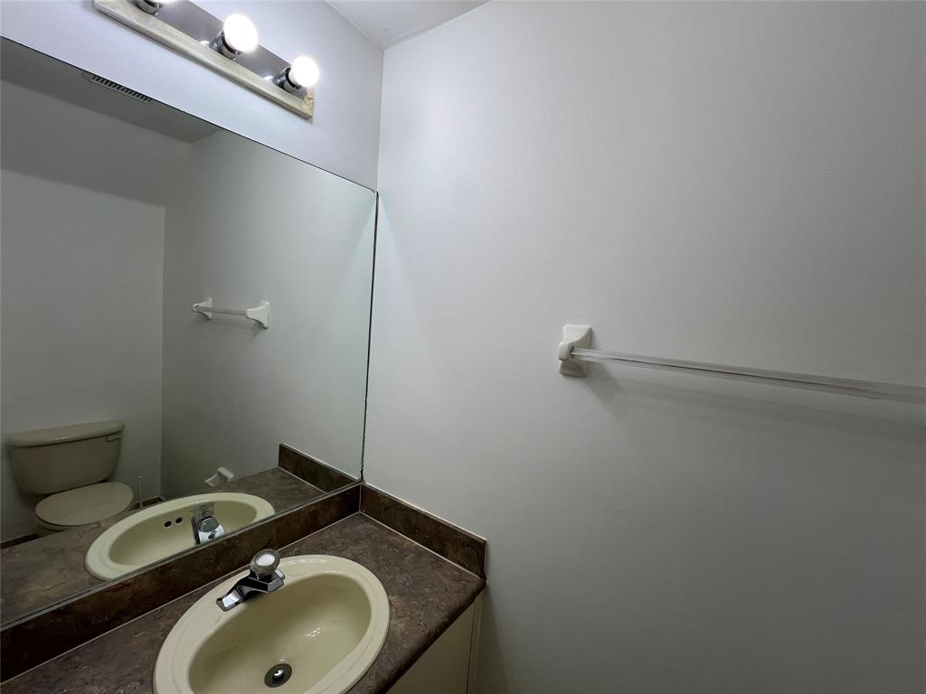 6756 Sienna Club Drive, Unit 6756 Lauderhill, FL 33319 - Photo 13 of 24 a bathroom with a sink and toilet