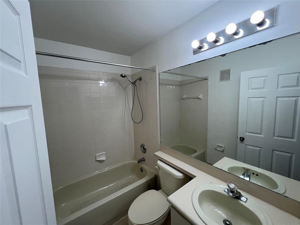 6756 Sienna Club Drive, Unit 6756 Lauderhill, FL 33319 - Photo 20 of 24 a bathroom with a sink a toilet and shower