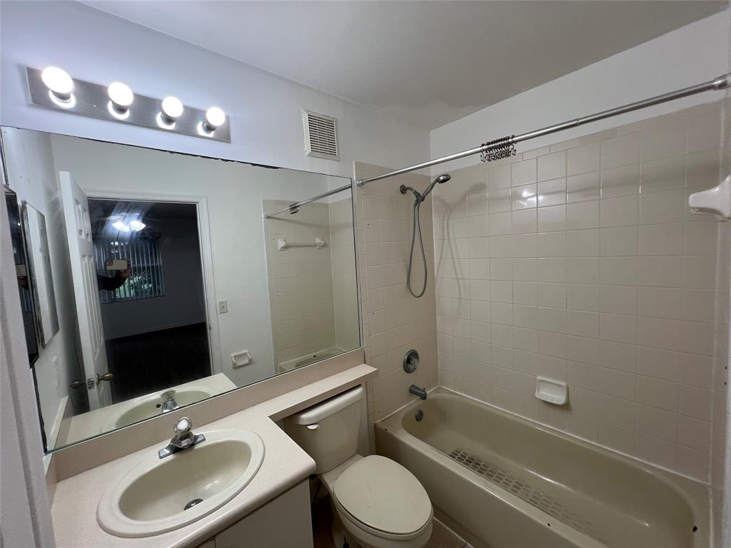6756 Sienna Club Drive, Unit 6756 Lauderhill, FL 33319 - Photo 24 of 24 a bathroom with a sink a toilet and shower a mirror