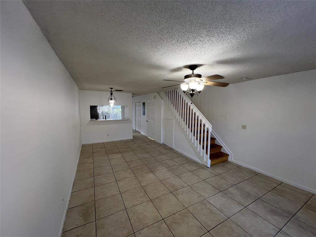 6756 Sienna Club Drive, Unit 6756 Lauderhill, FL 33319 - Photo 3 of 24 a view of a hallway with entryway and chandelier fan