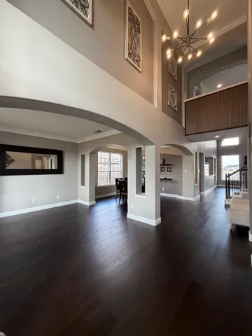 a view of interior and hall with wooden floor