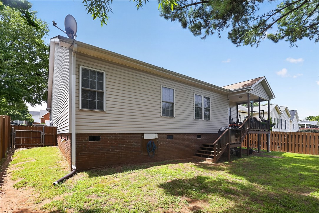 144 Elliott Circle Anderson, SC 29621 - Photo 24 of 30 A private, fenced backyard features a covered porch and direct access to the home's rear entrance.
