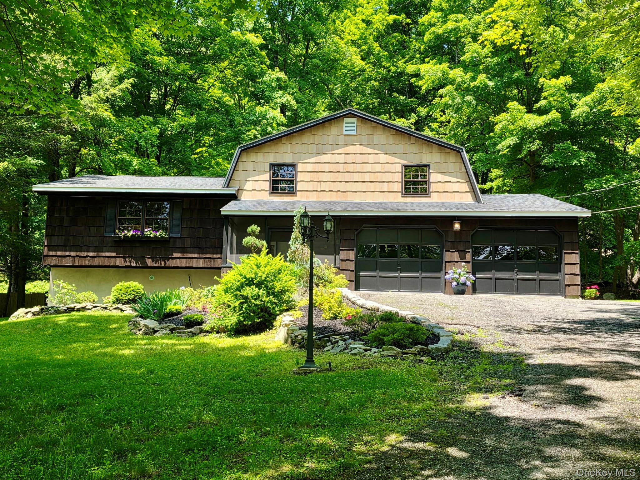 687 Sprout Brook Road Putnam Valley, NY 10579 - Photo 1 of 45 a view of a house with backyard and porch