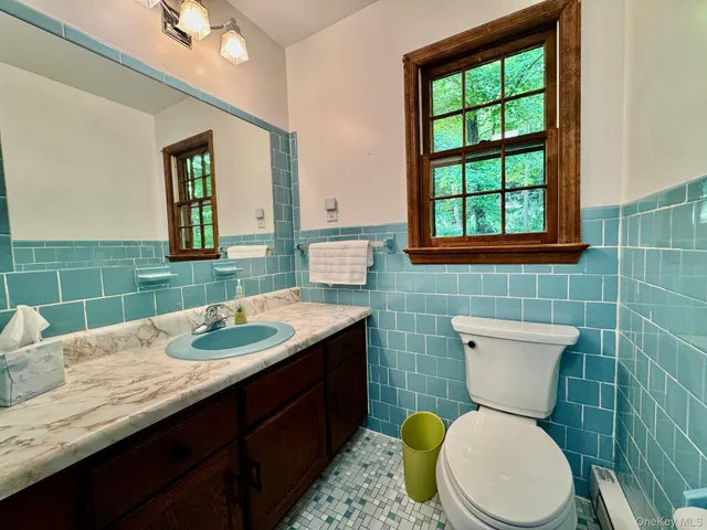 a view of wooden floor and windows in a room
