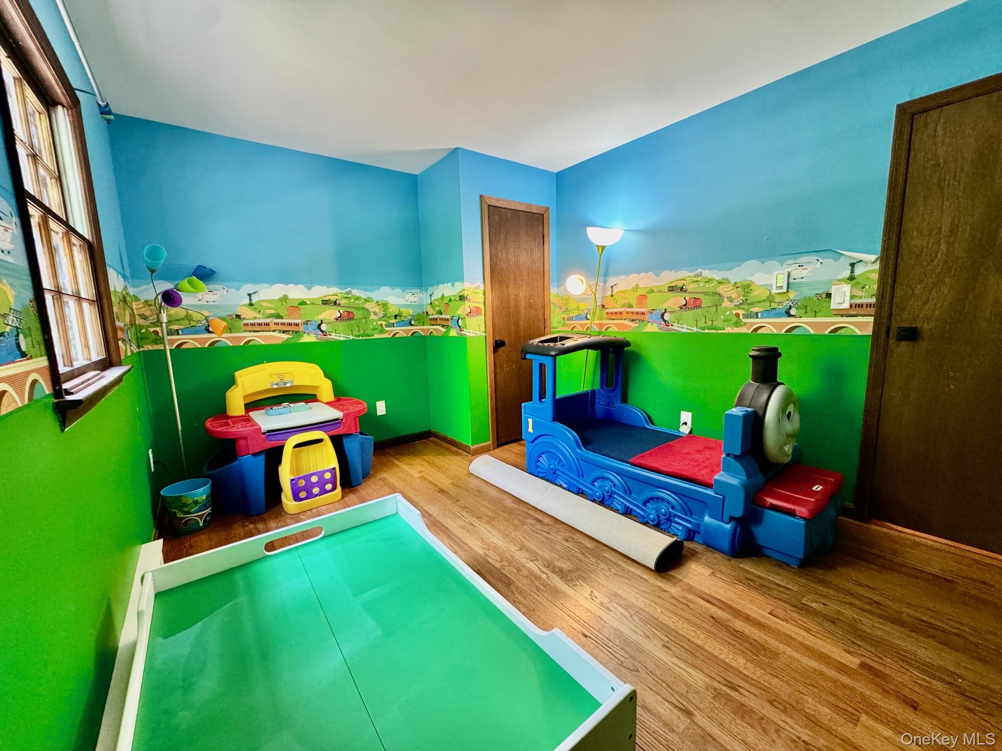 687 Sprout Brook Road Putnam Valley, NY 10579 - Photo 24 of 45 a living room with furniture and a play ground