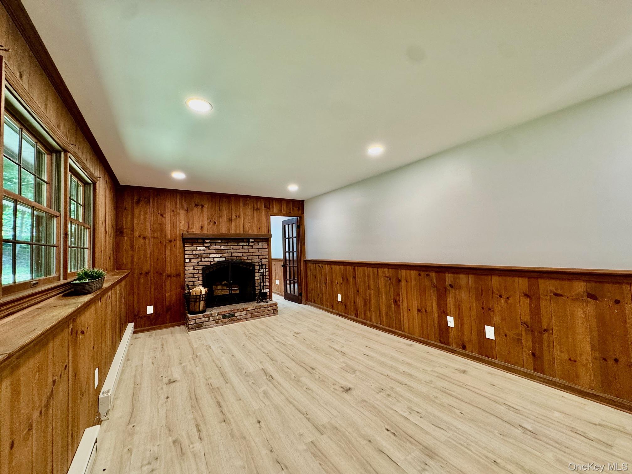 687 Sprout Brook Road Putnam Valley, NY 10579 - Photo 25 of 45 a view of an empty room with a fireplace and window