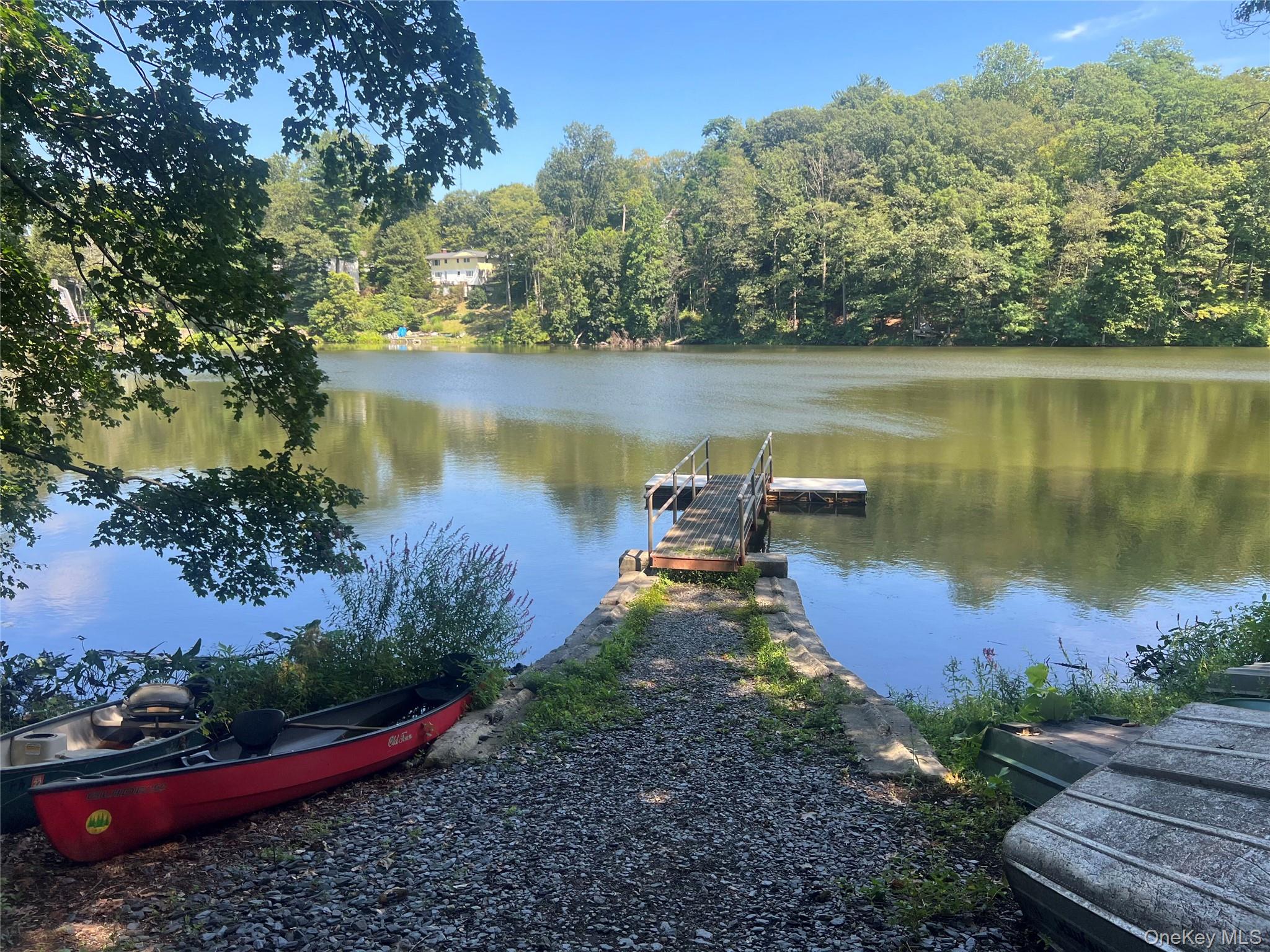 687 Sprout Brook Road Putnam Valley, NY 10579 - Photo 41 of 45 an aerial view of a house with a lake view