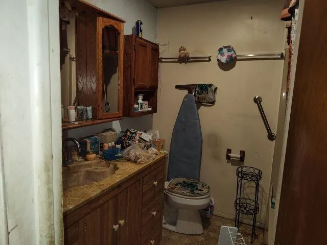 a bathroom with a sink and toilet
