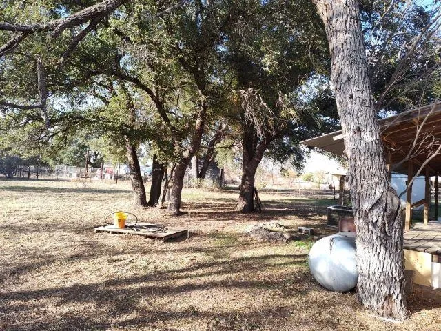 a view of a backyard of the house