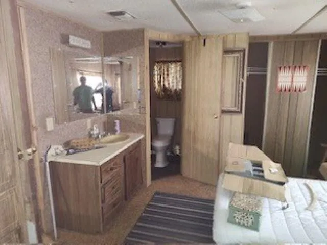 a en suite bathroom with a sink and mirror
