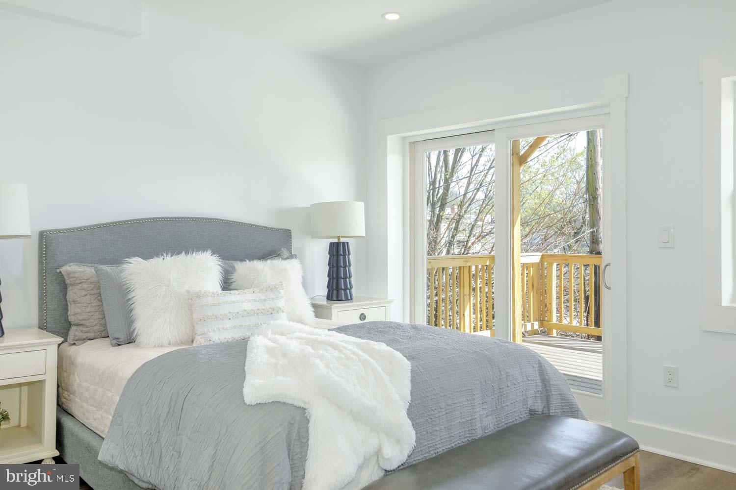 424 Taylor Street Northwest, Unit B Washington, DC 20011 - Photo 23 of 51 a bedroom with a bed and a large window