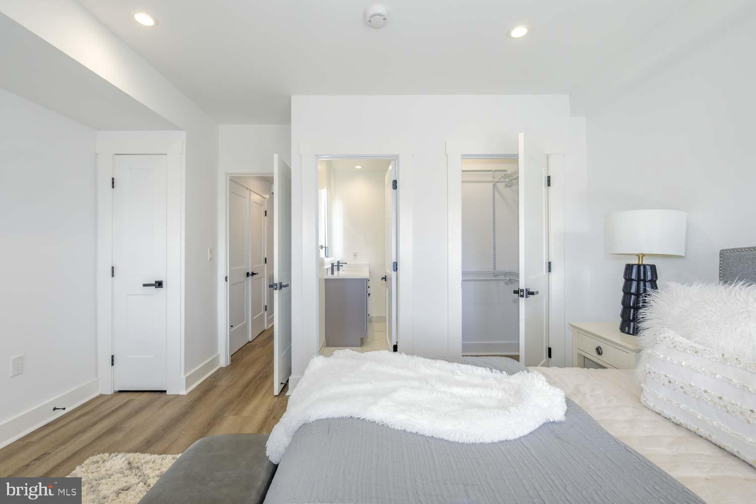 424 Taylor Street Northwest, Unit B Washington, DC 20011 - Photo 26 of 51 a bedroom with a bed and a mirror