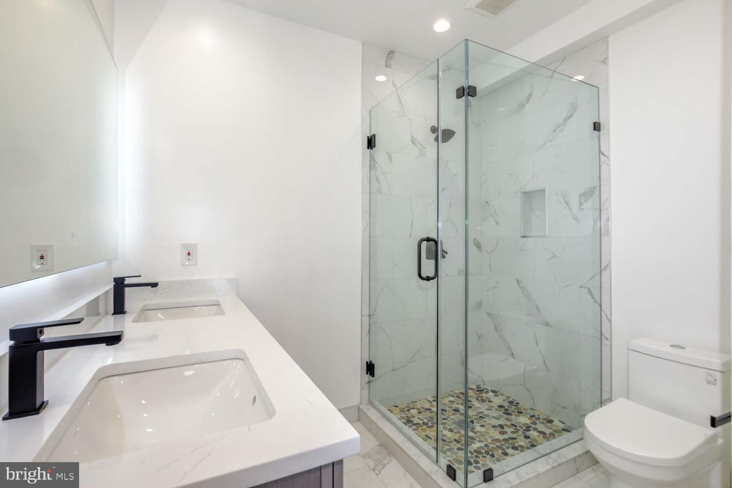 424 Taylor Street Northwest, Unit B Washington, DC 20011 - Photo 28 of 51 a bathroom with a sink a toilet and shower