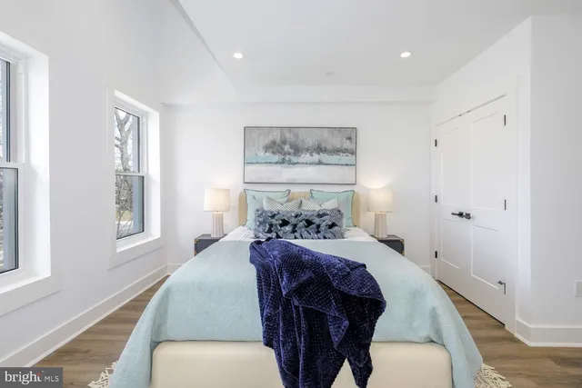 a bedroom with furniture and windows