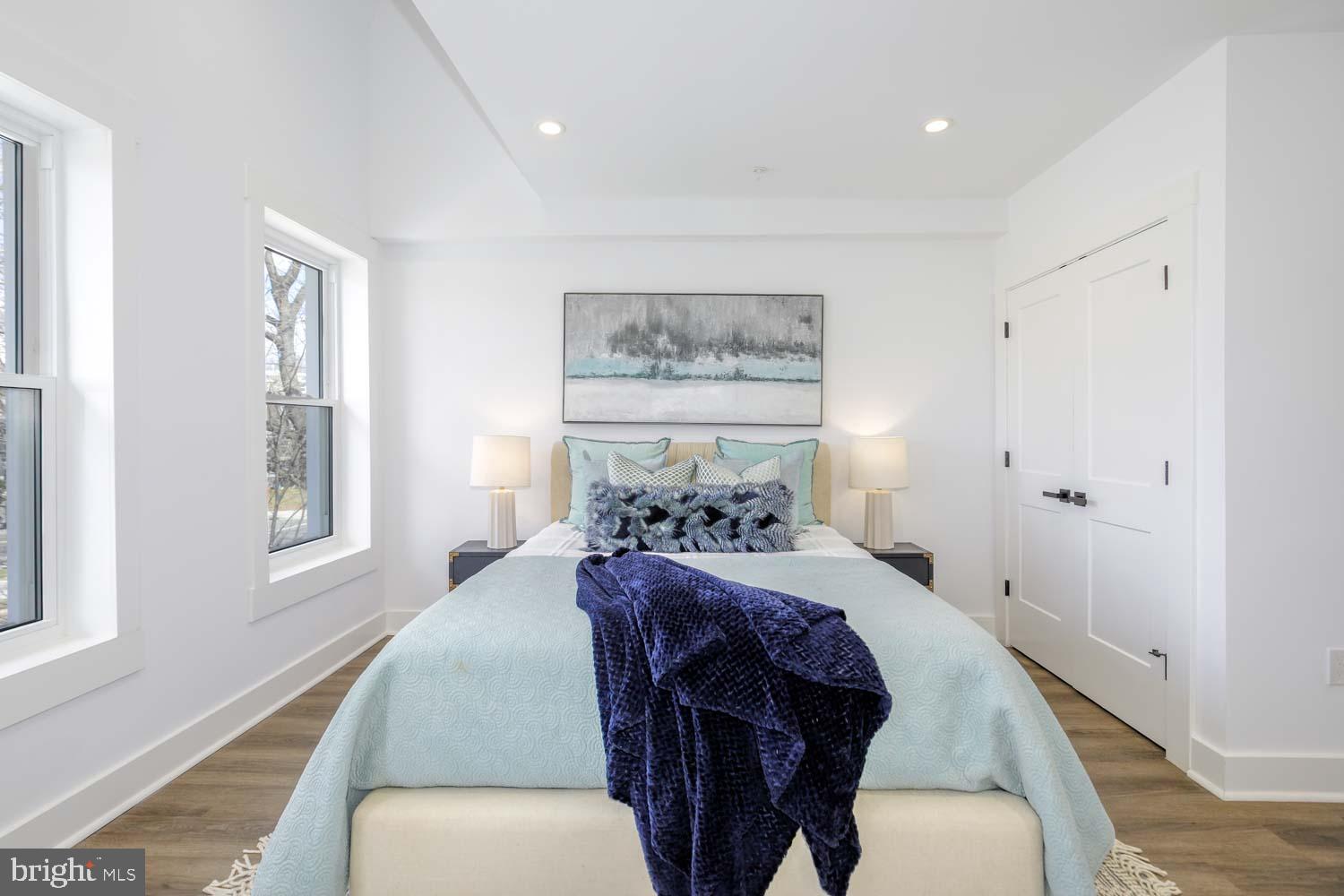 424 Taylor Street Northwest, Unit B Washington, DC 20011 - Photo 32 of 51 a bedroom with a bed and wooden floor