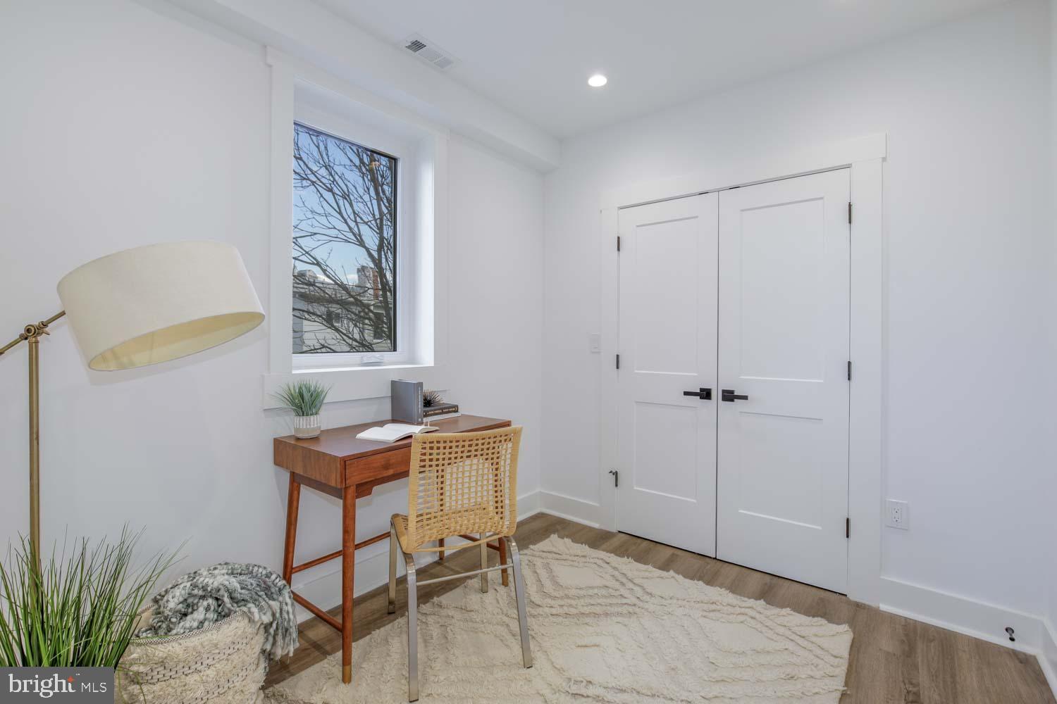 424 Taylor Street Northwest, Unit B Washington, DC 20011 - Photo 40 of 51 a view of a workspace with furniture and a window