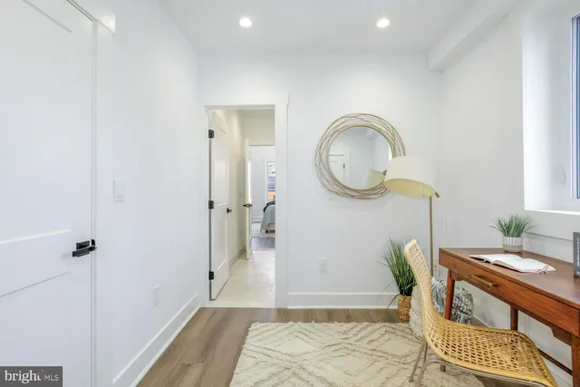 a bedroom with a bed and a table in it