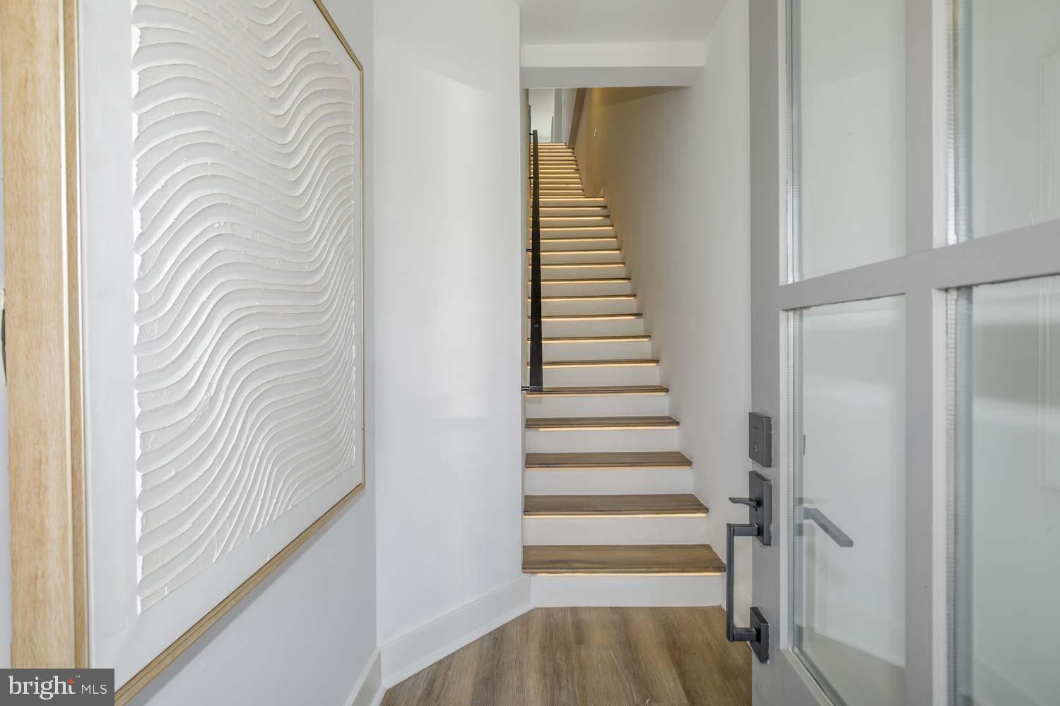 424 Taylor Street Northwest, Unit B Washington, DC 20011 - Photo 46 of 51 a view of a hallway with wooden floor and entryway