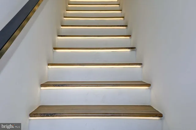 a view of a balcony with a floor to ceiling window and wooden floor