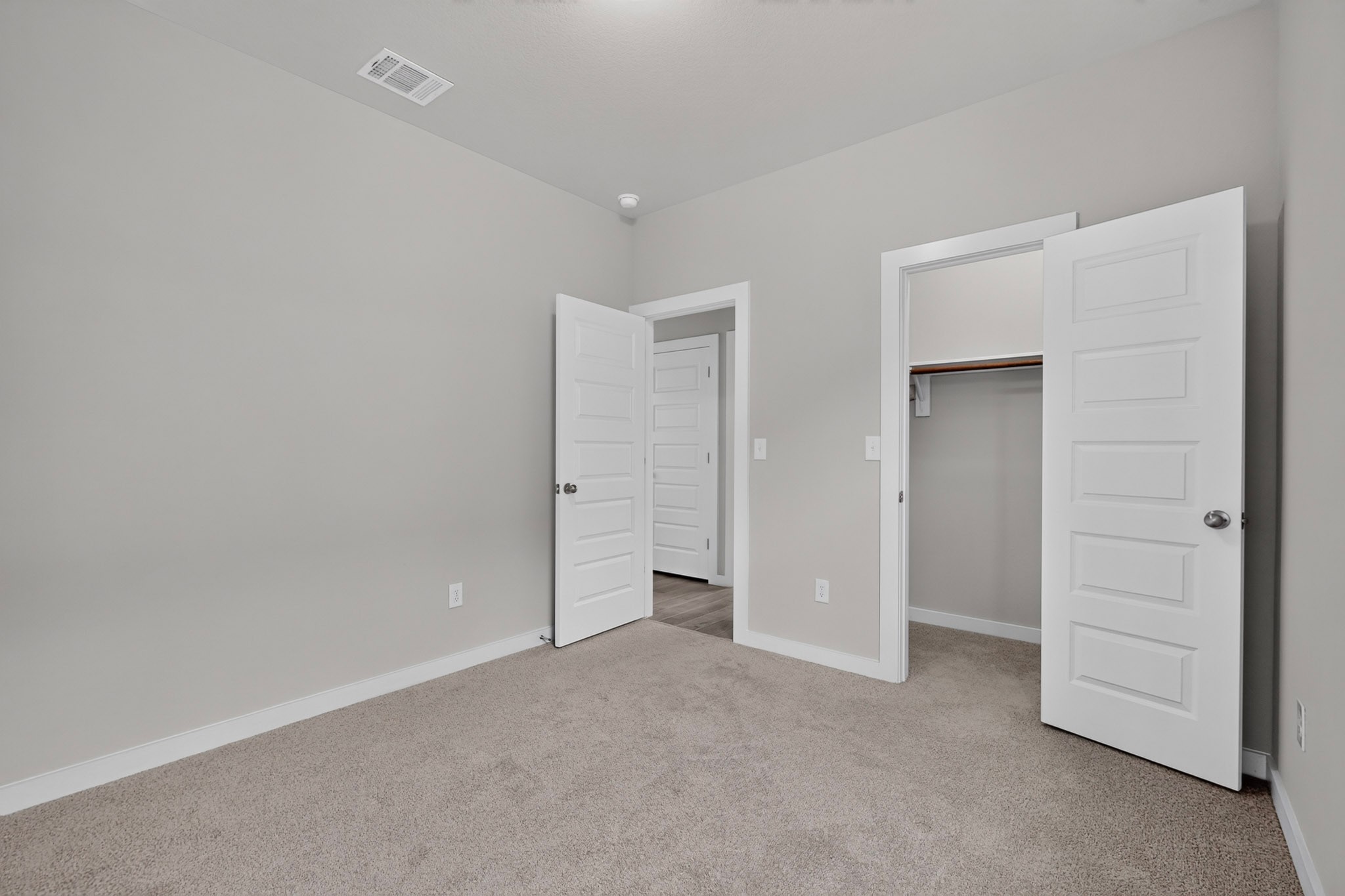 116 Appleberry Lane Elgin, TX 78621 - Photo 21 of 35 A well-lit bedroom provides comfortable living with soft carpeting and convenient closet access.