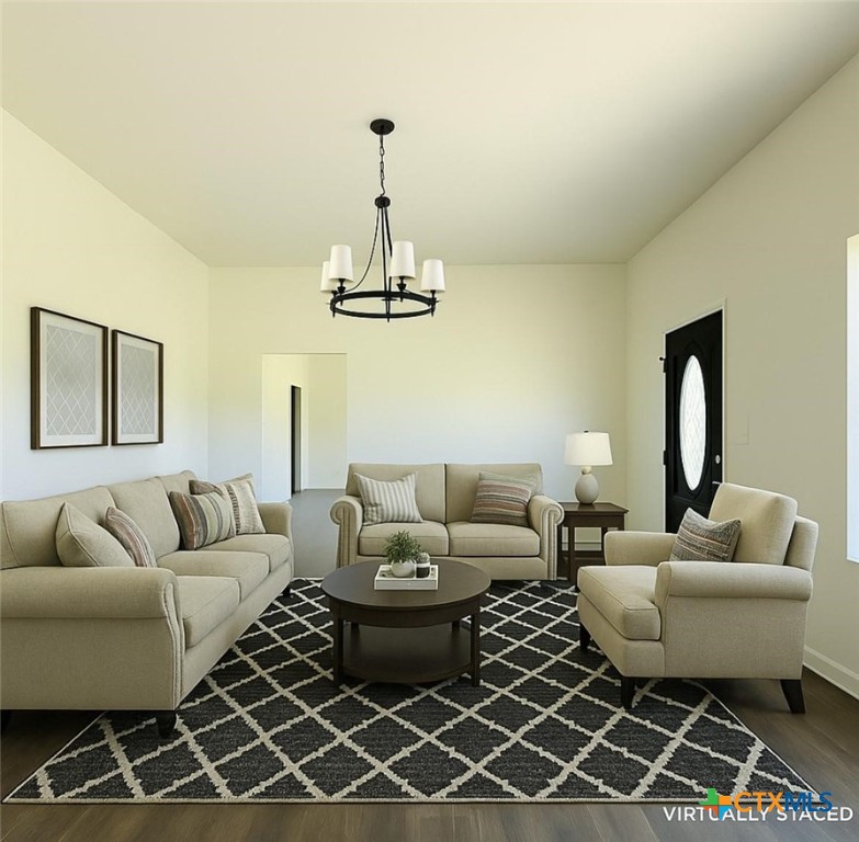 3633 North Katy Road Elm Mott, TX 76640 - Photo 7 of 26 a living room with furniture a rug and a chandelier