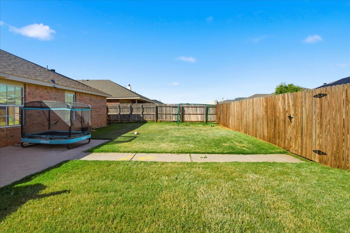 6538 93rd Street Lubbock, TX 79424 - Photo 24 of 27 a view of backyard with green space