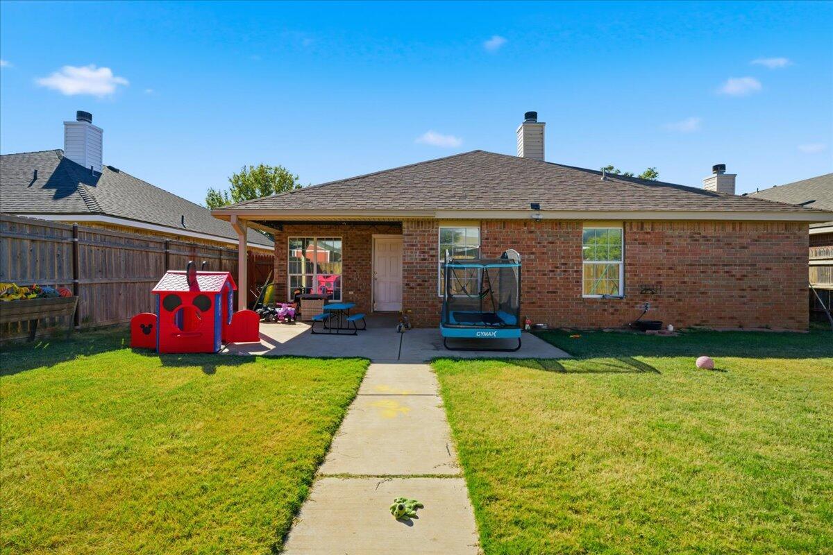 6538 93rd Street Lubbock, TX 79424 - Photo 25 of 27 a view of swimming pool of house with yard