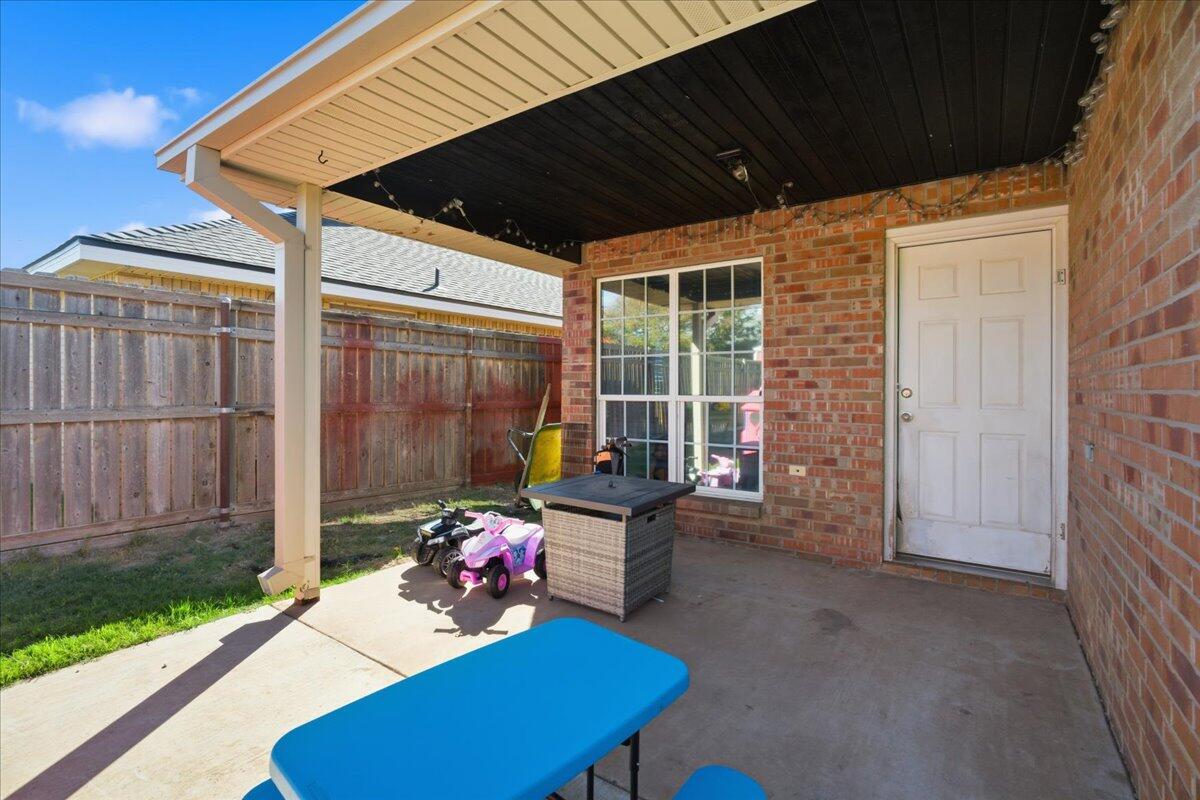6538 93rd Street Lubbock, TX 79424 - Photo 26 of 27 a backyard of a house with seating space