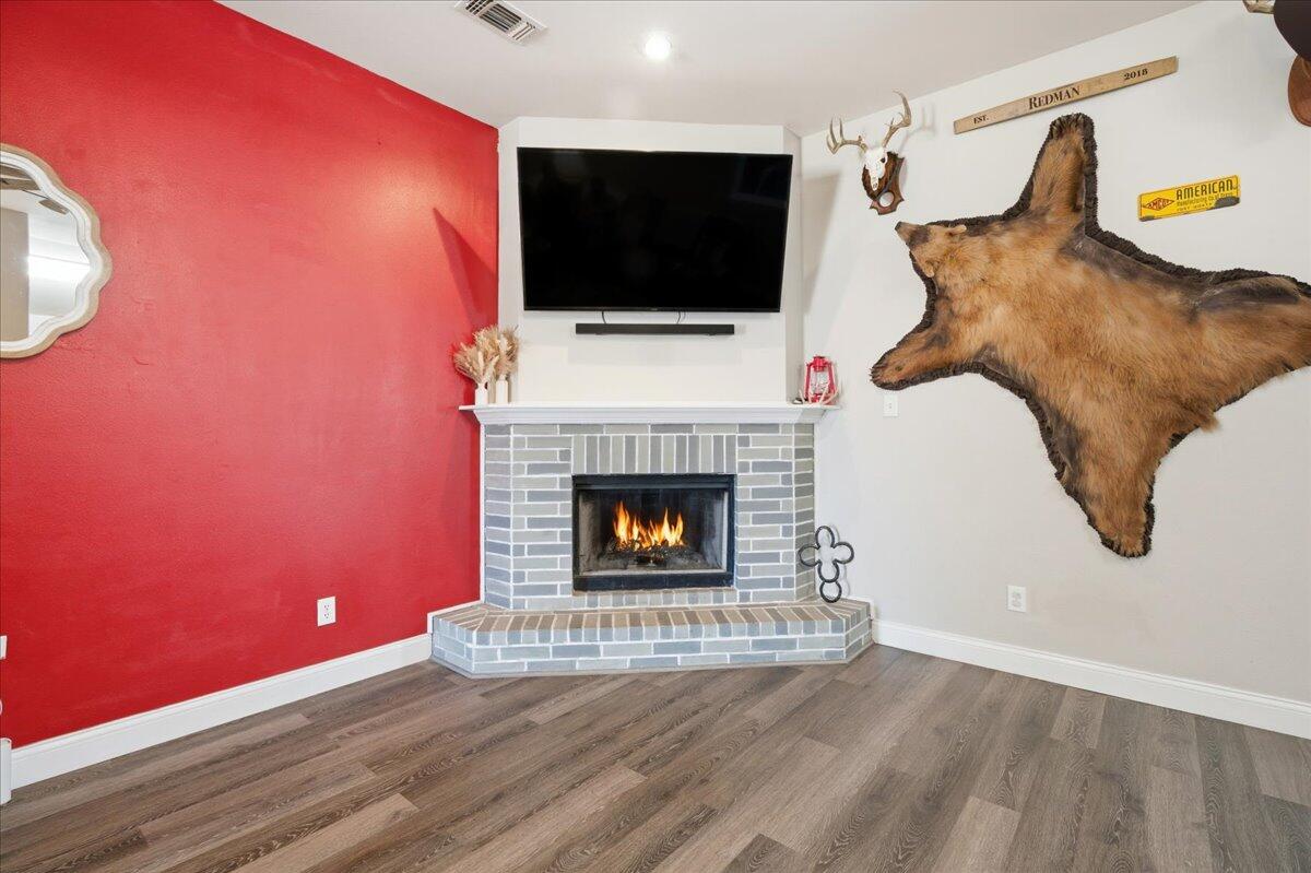 6538 93rd Street Lubbock, TX 79424 - Photo 5 of 27 a living room with furniture and a fireplace