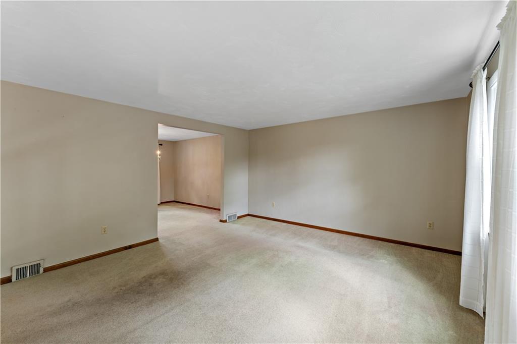 27 Dover Road Irwin, PA 15642 - Photo 4 of 43 an empty room with a natural light