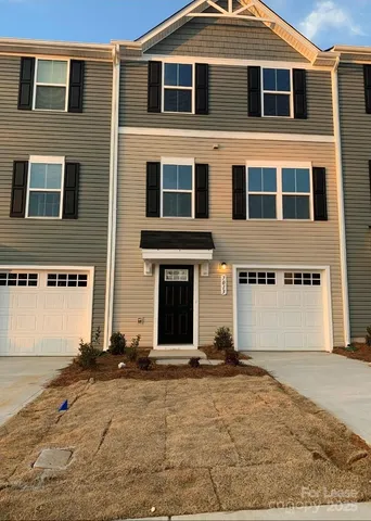 a front view of a house with yard