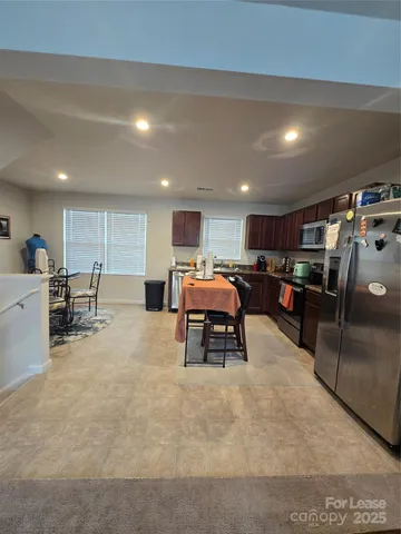 a room with furniture and a large window