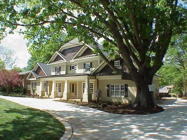 3324 Thomas Road Raleigh, NC 27607 - Photo 2 of 12 a front view of a house with a yard