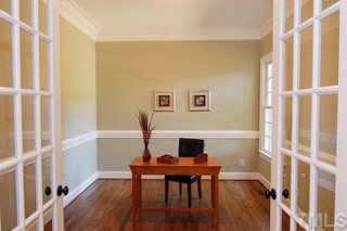 3324 Thomas Road Raleigh, NC 27607 - Photo 8 of 12 a view of a workspace with furniture and a window