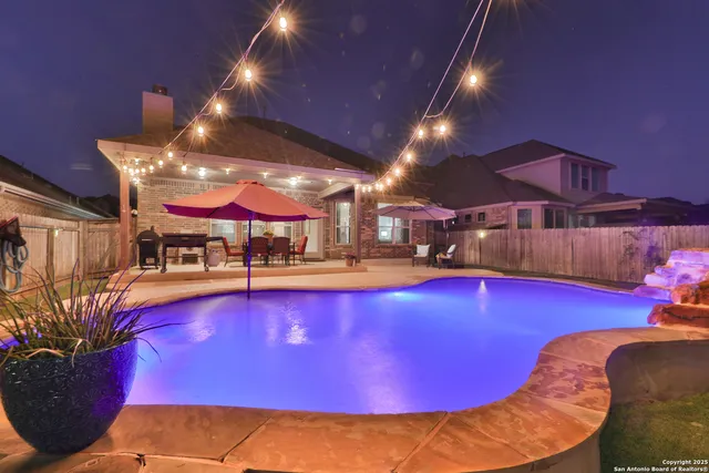 a view of a swimming pool with seating area