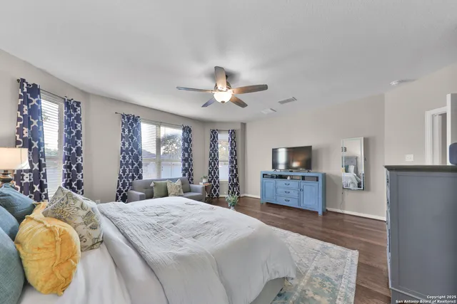 a bed room with a bed and a television