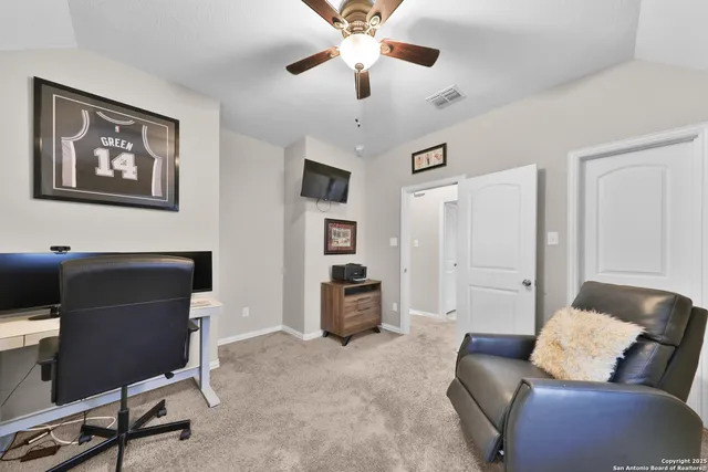 a livingroom with workspace couch and a couch