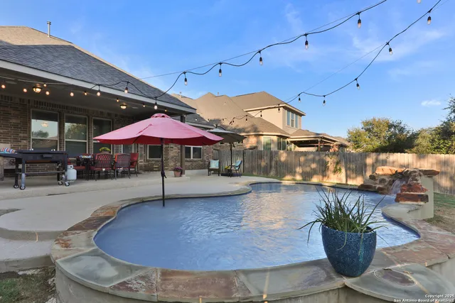 a view of a swimming pool with a patio
