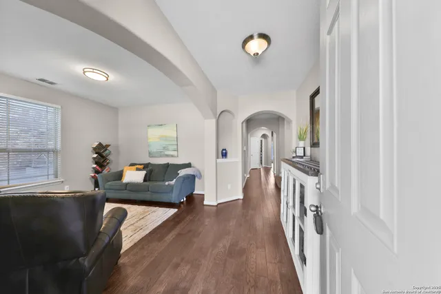 a living room with furniture and a window