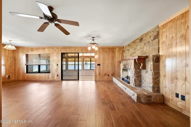 a view of an entryway with wooden floor