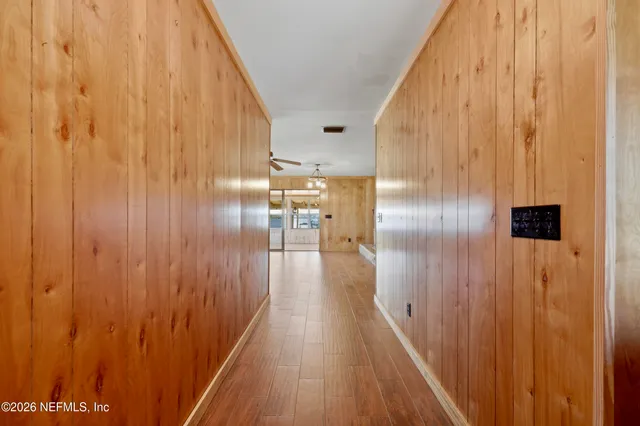 a view of gallery with wooden floor