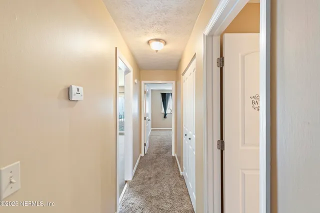 a view of a livingroom from a hallway