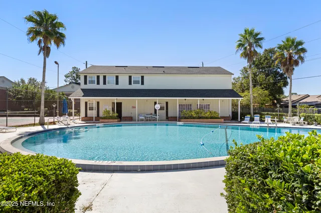 a view of a house with a swimming pool