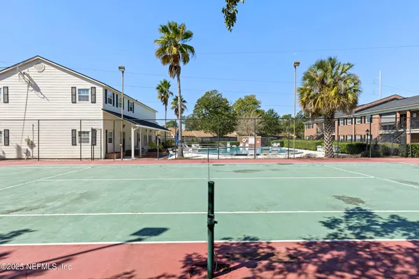 a view of a street with a building in the background