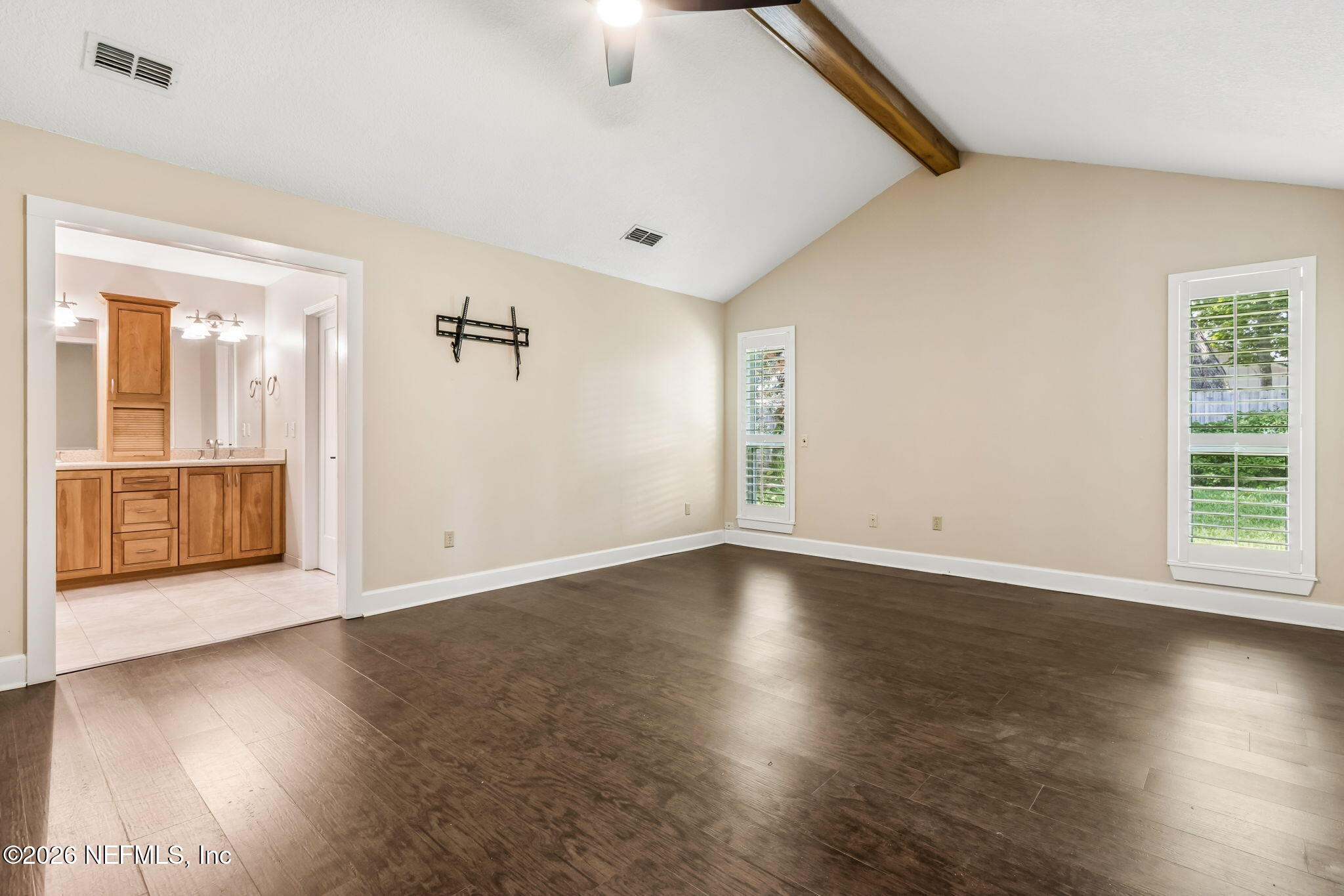 1877 Christopher Point Road South Jacksonville, FL 32217 - Photo 9 of 27 an empty room with wooden floor and windows