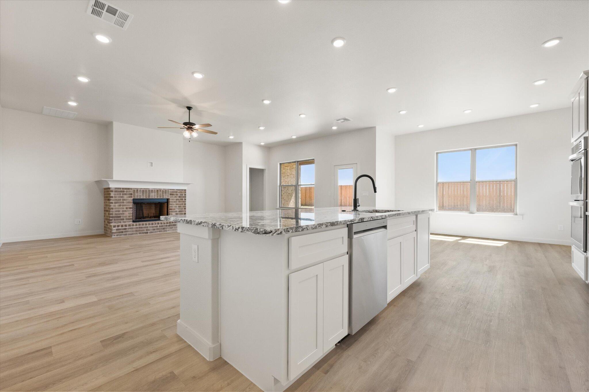6103 121st Street Lubbock, TX 79424 - Photo 14 of 30 a kitchen with sink and cabinets