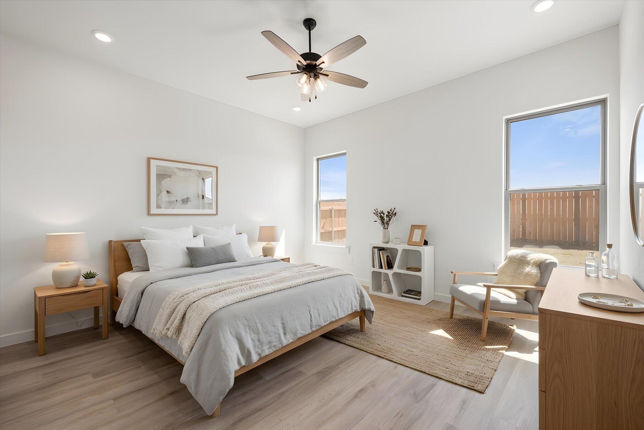 6103 121st Street Lubbock, TX 79424 - Photo 17 of 30 a bedroom with a bed and a chandelier